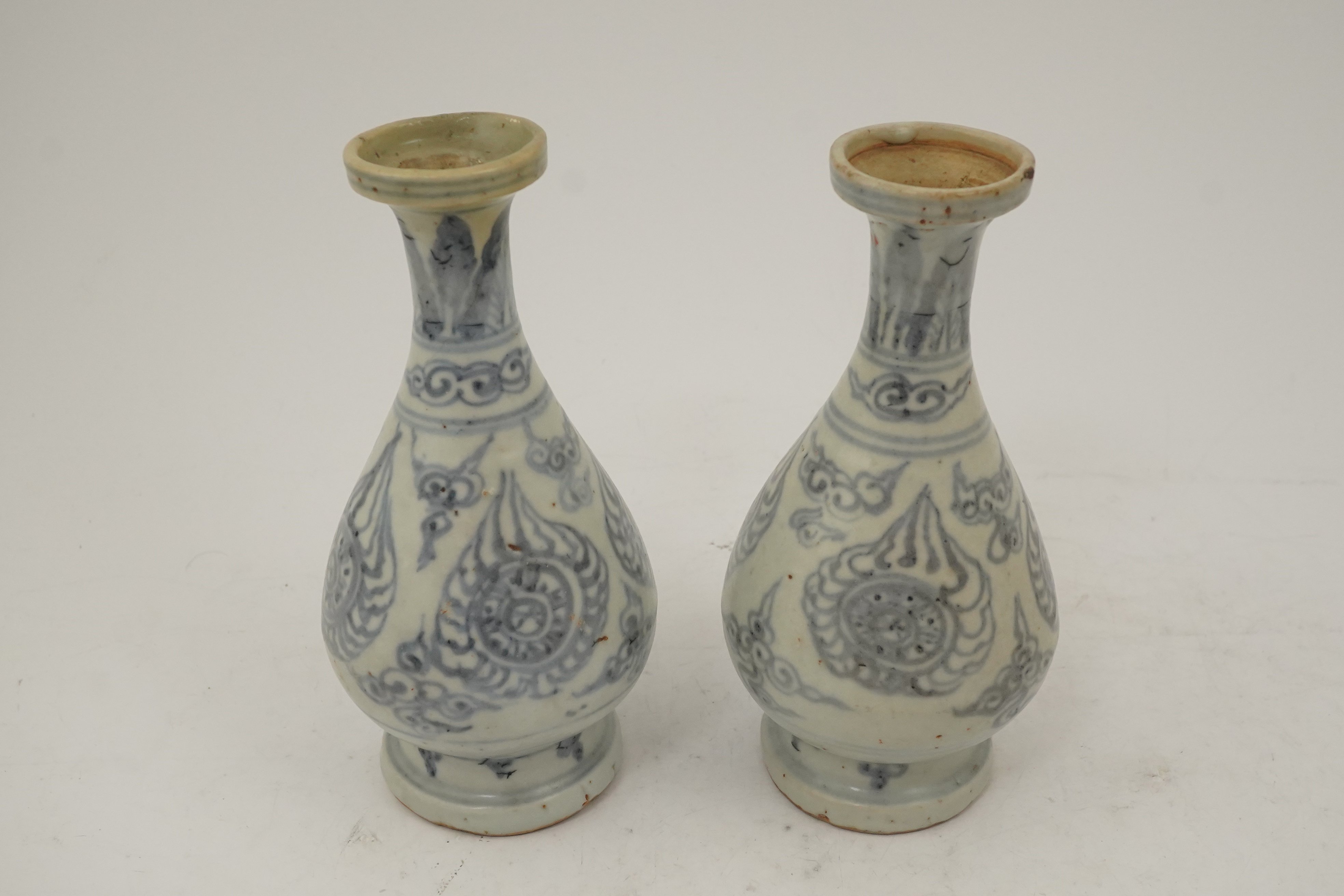 A pair of Chinese blue and white pear-shaped shipwreck vases, Ming dynasty, 15th century